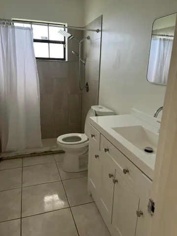 a view of a bathroom with white door