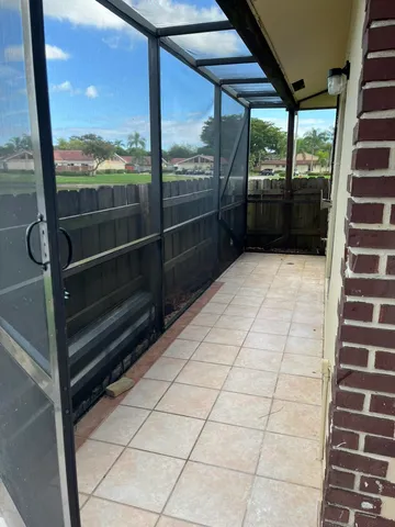a view of a glass door with glass windows