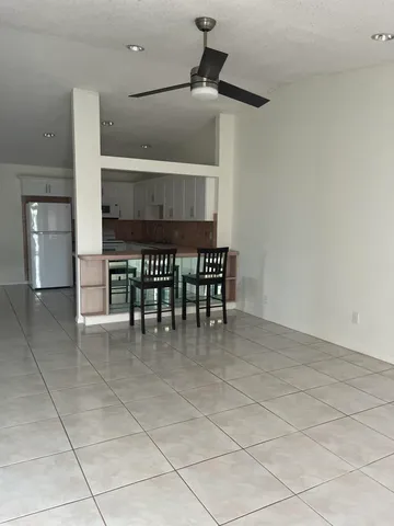 a view of kitchen with furniture and window