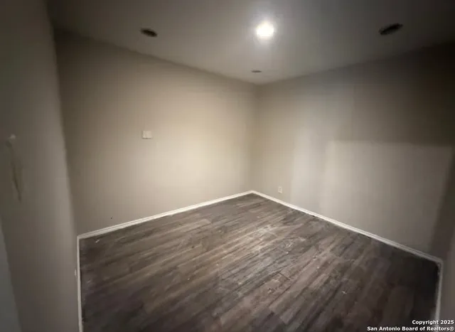 a view of an empty room and window