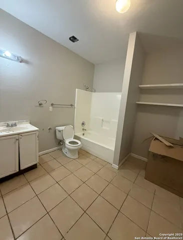 a view of a backyard with large trees