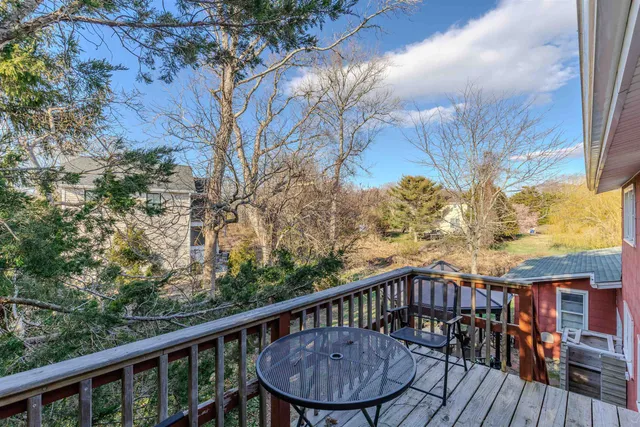 a view of a balcony with a furniture