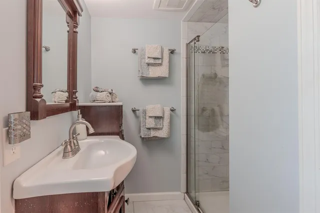 a bathroom with a sink and a mirror