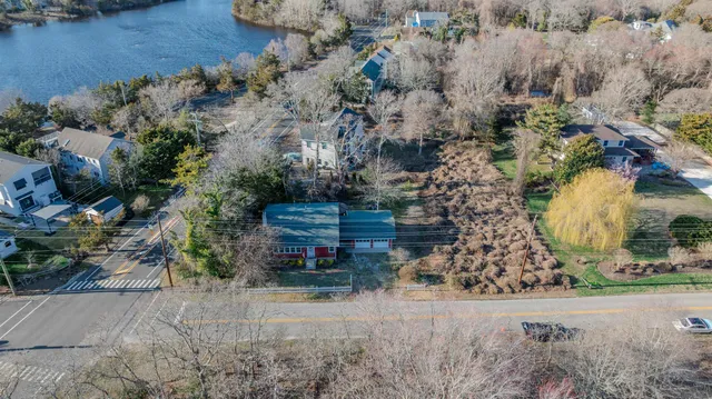 an aerial view of a house with a yard