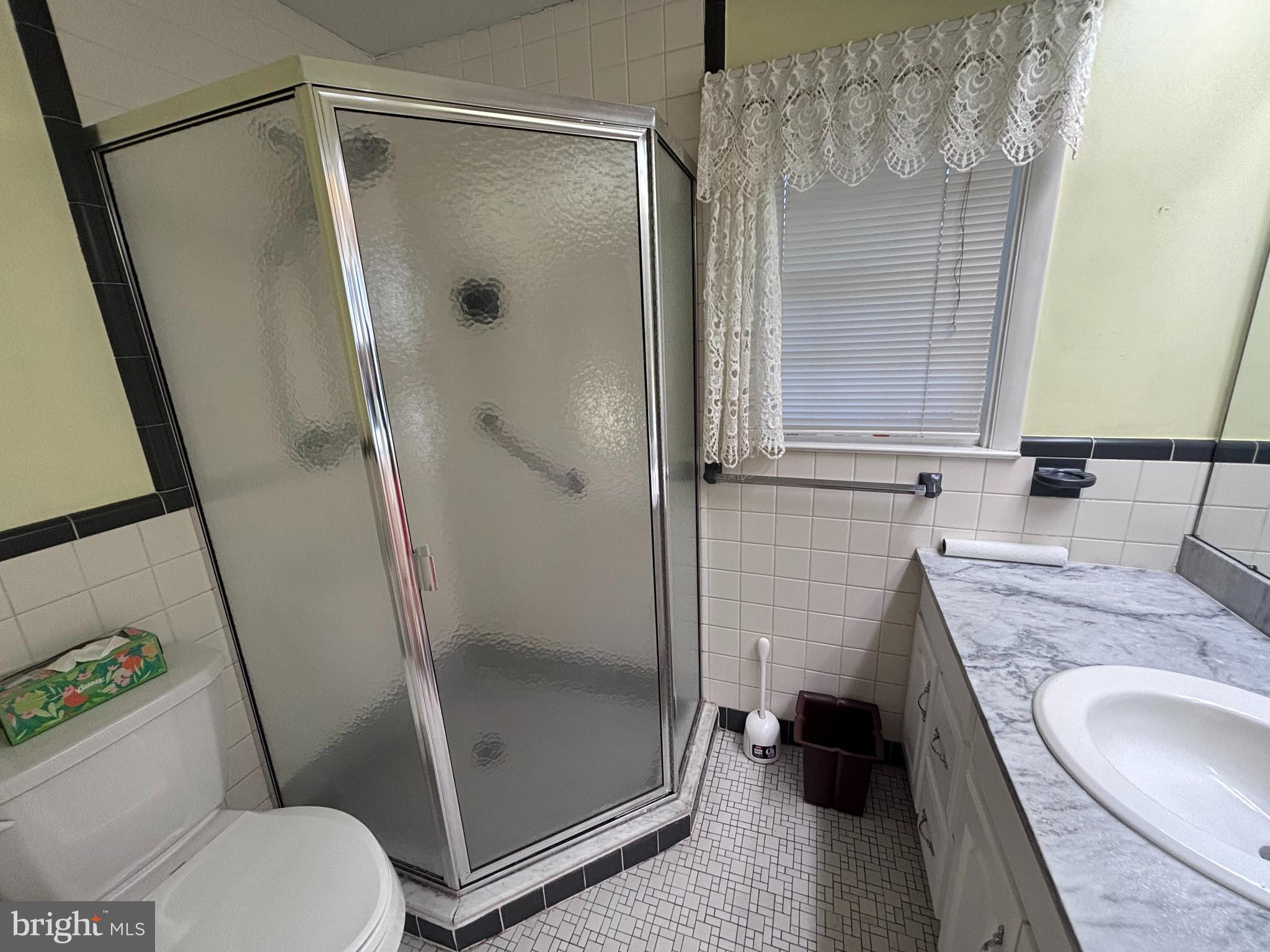 1930 Valley Road Jenkintown, PA 19046 - Photo 13 of 30 a bathroom with a granite countertop sink toilet and shower