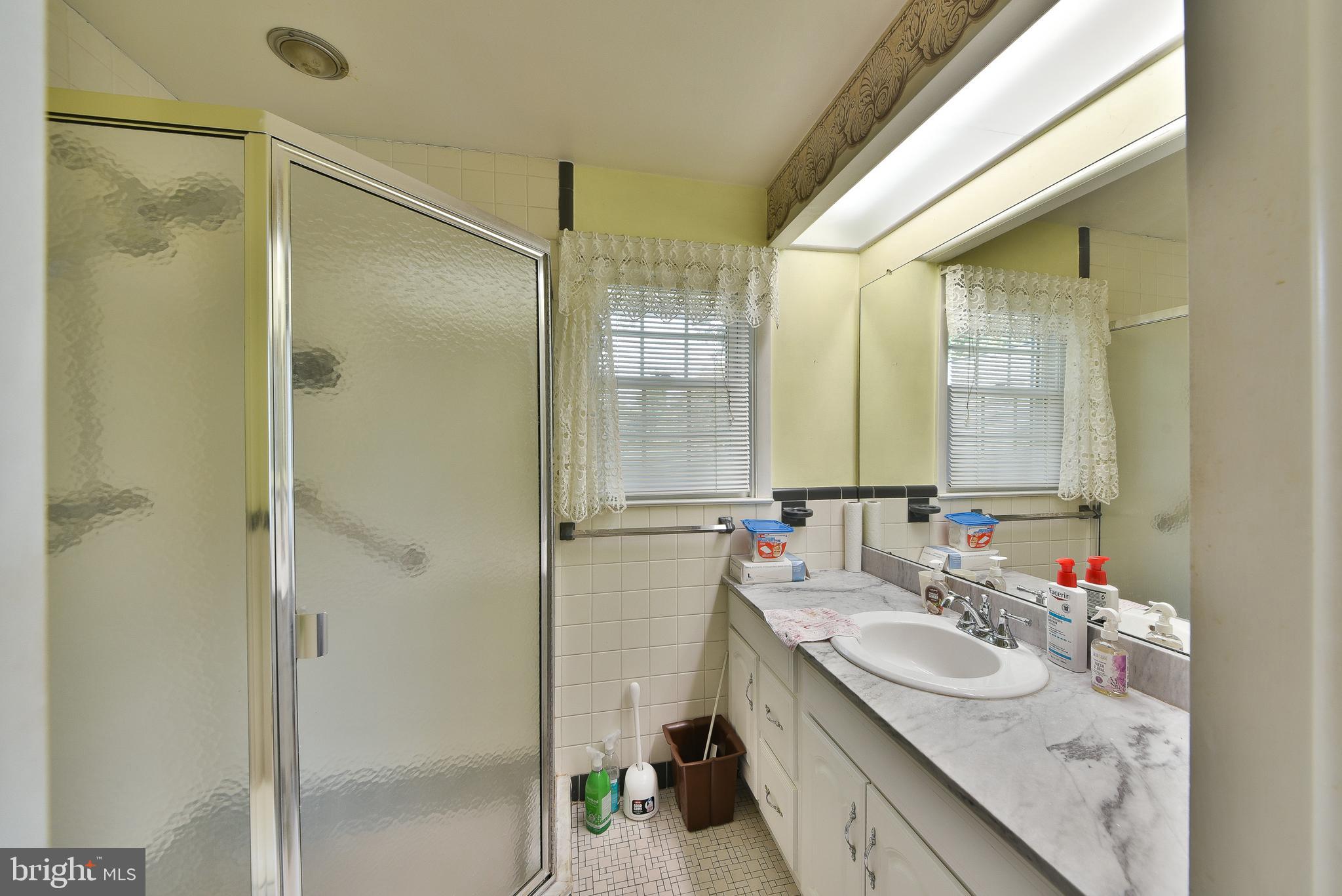 1930 Valley Road Jenkintown, PA 19046 - Photo 14 of 30 a bathroom with a granite countertop sink mirror and double
