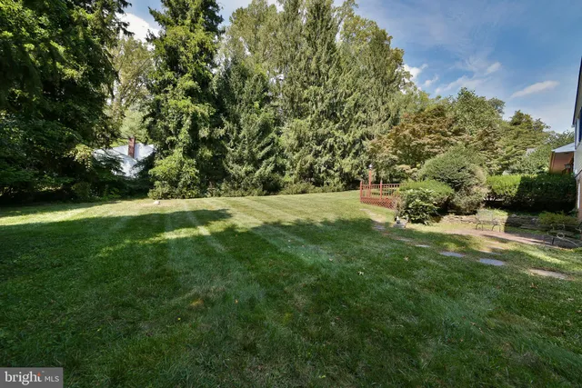 a view of outdoor space with deck and yard