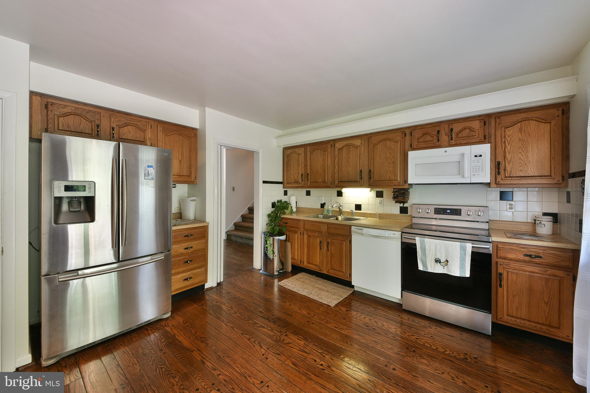 1930 Valley Road Jenkintown, PA 19046 - Photo 9 of 30 a kitchen with granite countertop stainless steel appliances a refrigerator and a stove top oven