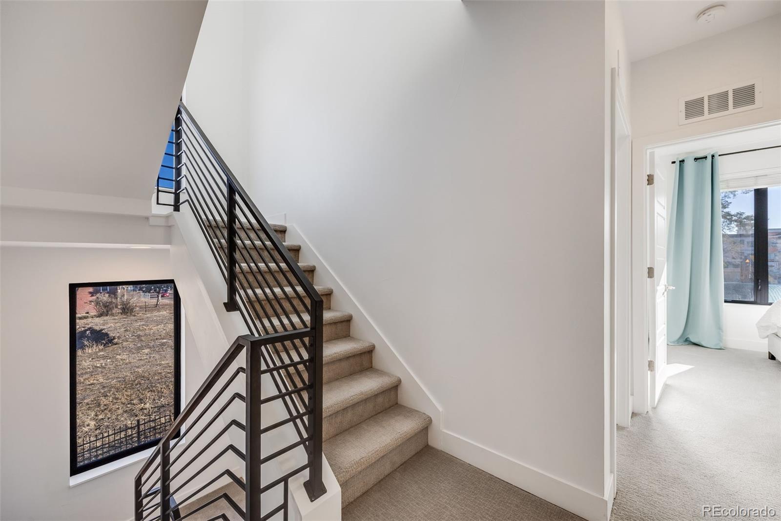 3011 West 53rd Avenue Denver, CO 80221 - Photo 24 of 44 a view of entryway and hall with wooden floor