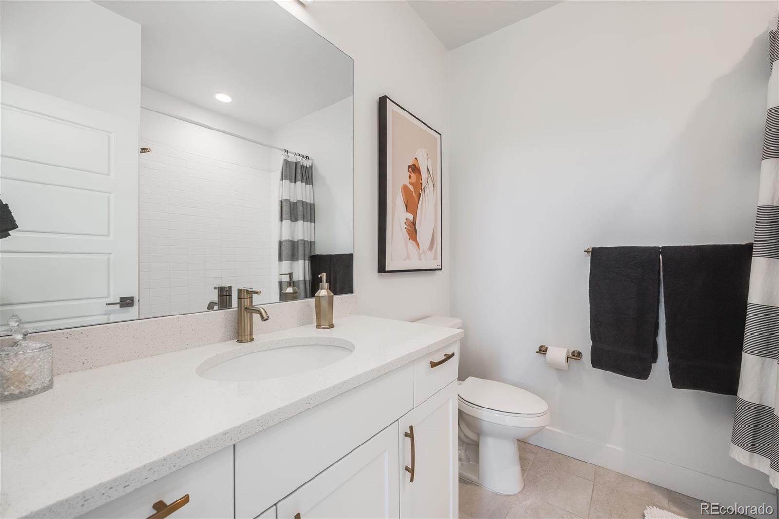 3011 West 53rd Avenue Denver, CO 80221 - Photo 26 of 44 a bathroom with a sink toilet and shower