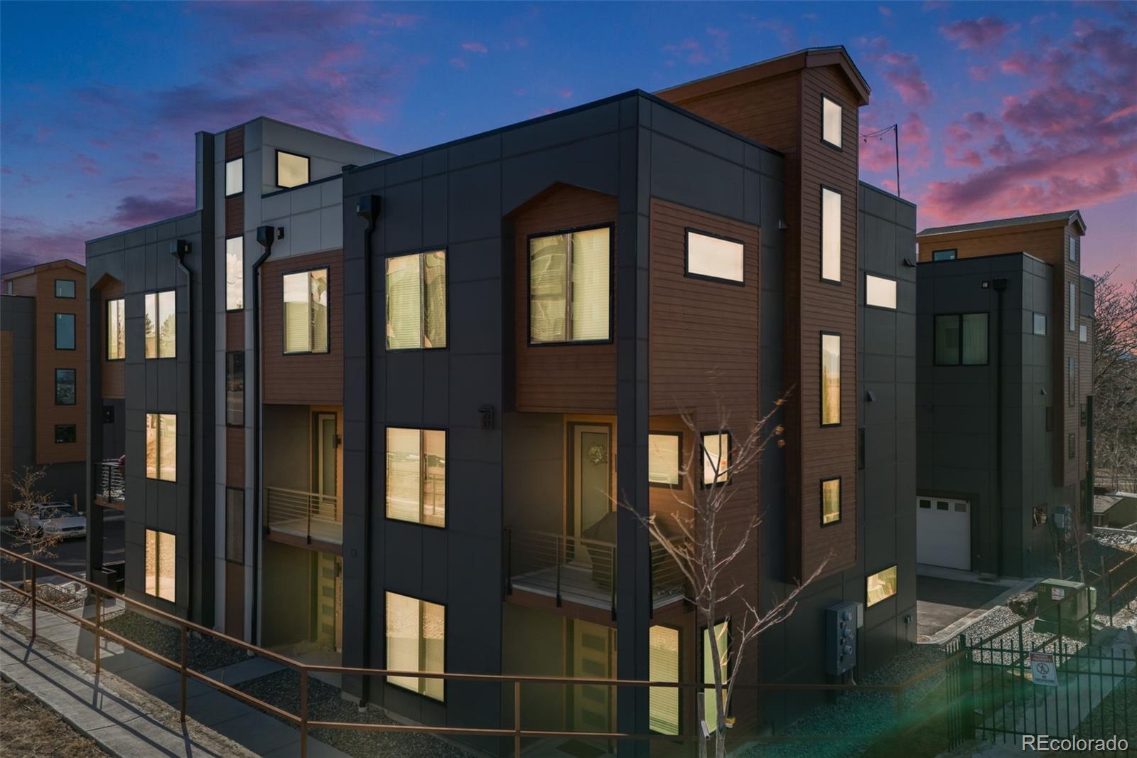 3011 West 53rd Avenue Denver, CO 80221 - Photo 3 of 44 a front view of a building with a glass door