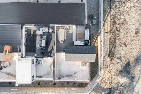 a view of city and wooden deck