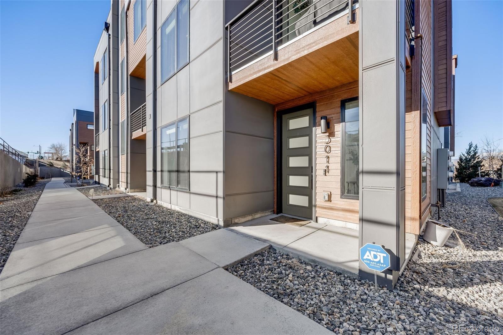 3011 West 53rd Avenue Denver, CO 80221 - Photo 5 of 44 a view of a entrance gate of a building