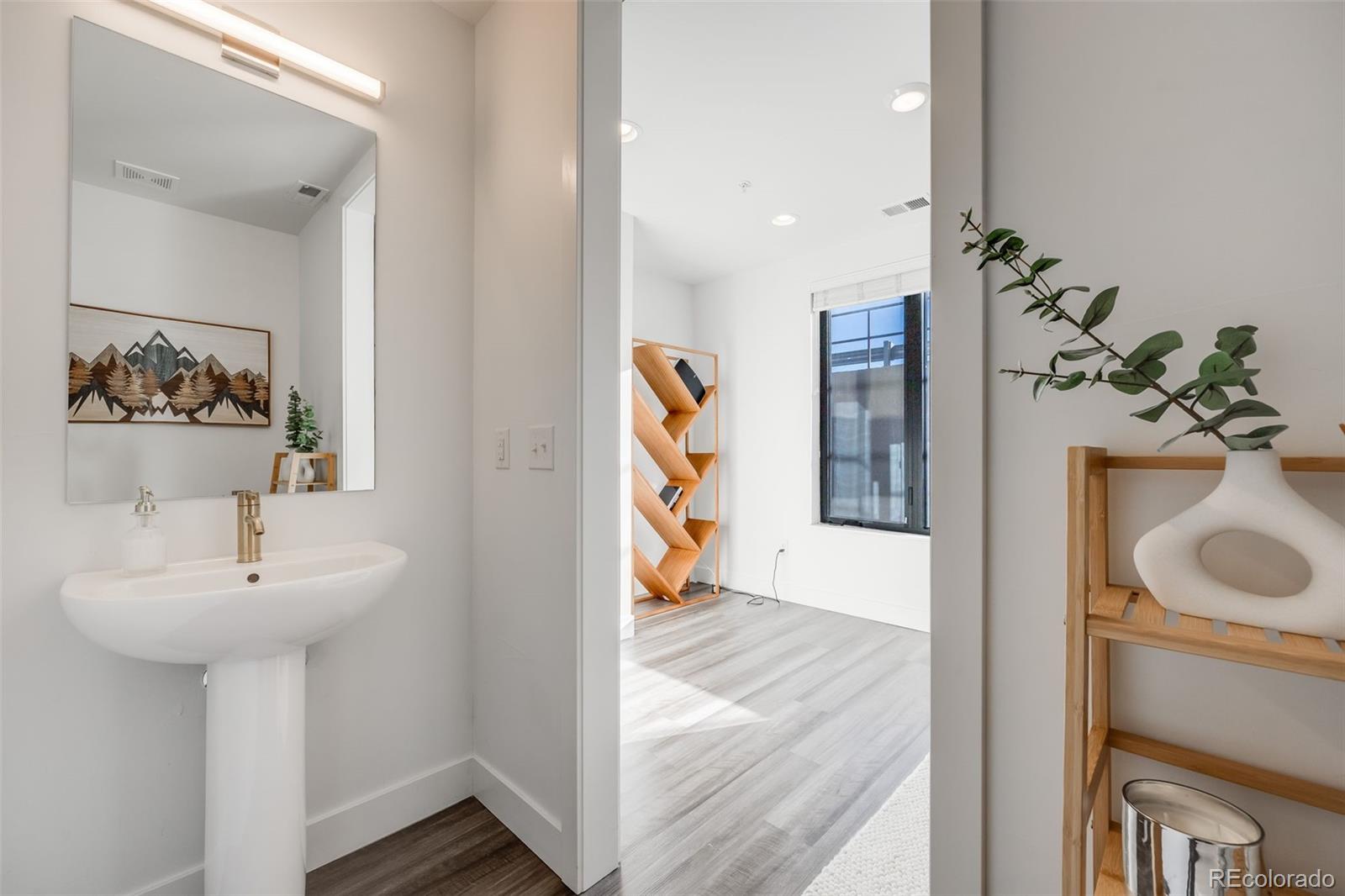 3011 West 53rd Avenue Denver, CO 80221 - Photo 9 of 44 a bathroom with a sink and a mirror