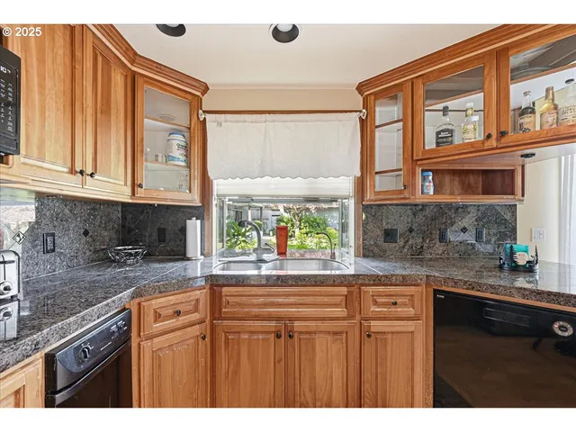 a kitchen view of counter top space and wooden floor