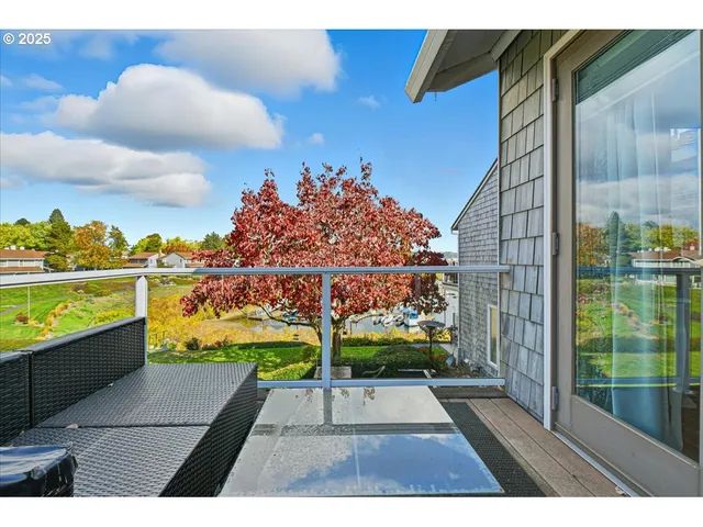 a kitchen with granite countertop a sink cabinets and stainless steel appliances