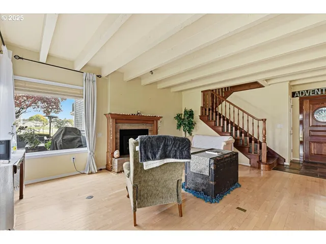 a living room with a fireplace and a fireplace