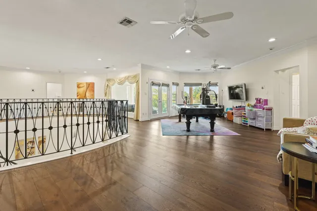 a view of a kitchen with furniture and wooden floor