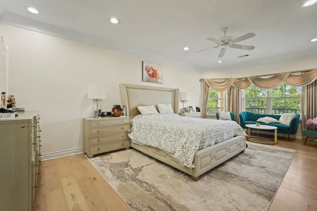 a bed room with a bed and a chair