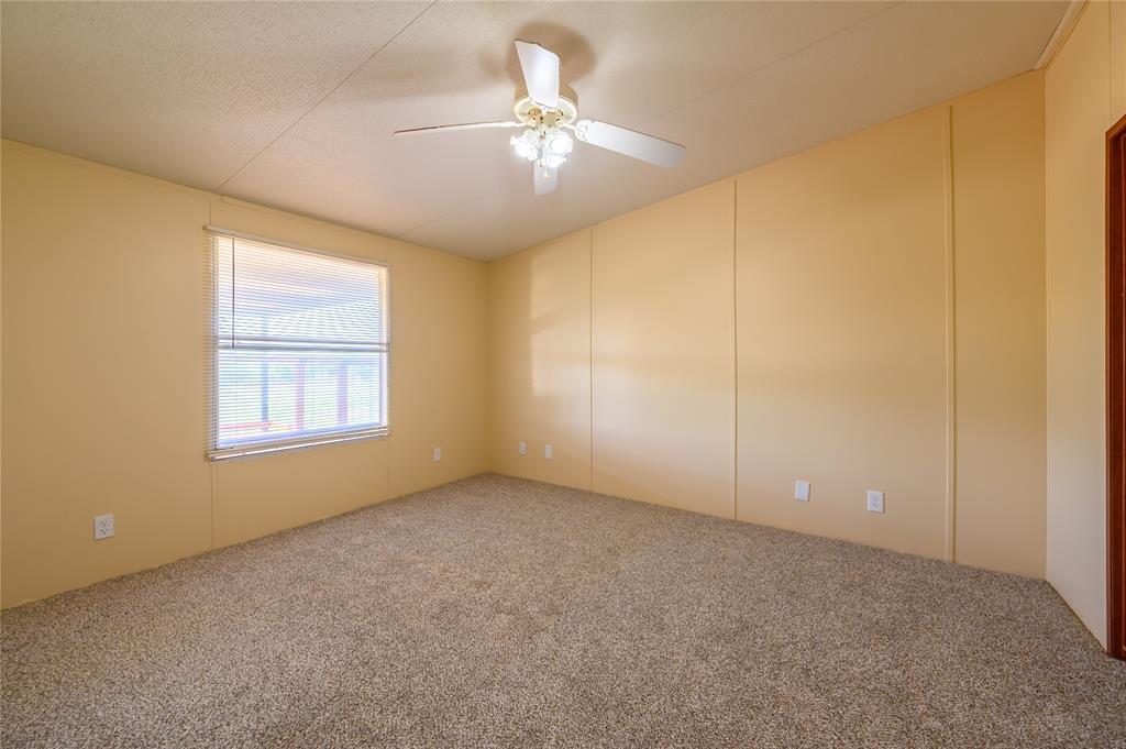 383 Soaring Eagle Trail Wichita Falls, TX 76310 - Photo 13 of 36 Carpeted empty room featuring ceiling fan