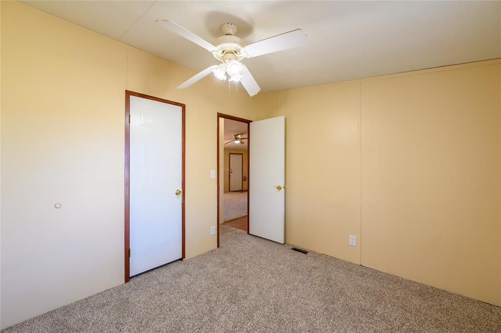 383 Soaring Eagle Trail Wichita Falls, TX 76310 - Photo 20 of 36 Unfurnished bedroom with carpet and ceiling fan