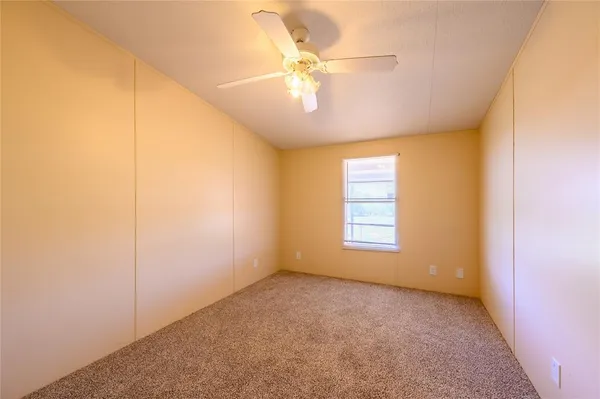 a kitchen with a table and chairs in it