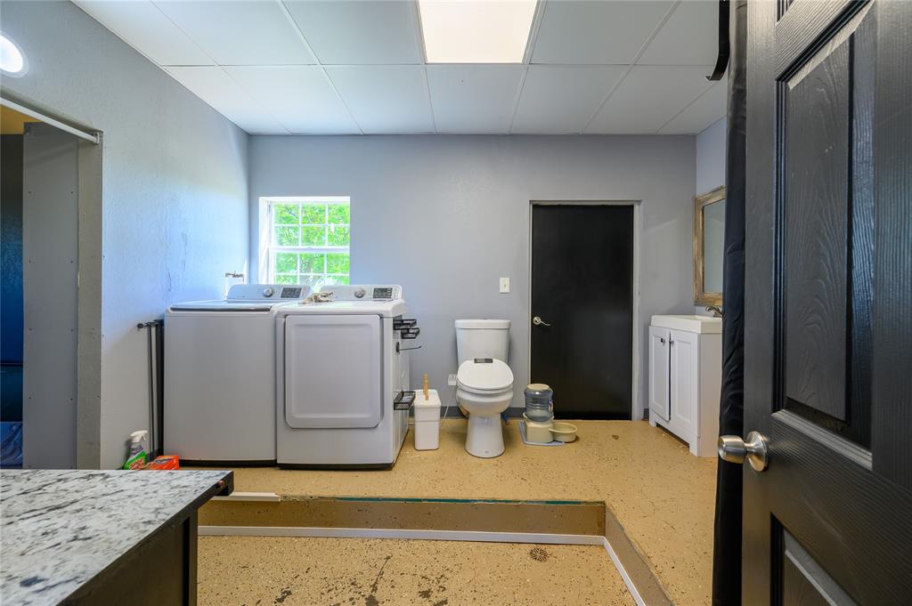 383 Soaring Eagle Trail Wichita Falls, TX 76310 - Photo 26 of 36 Bathroom with vanity, washer and dryer, and a paneled ceiling