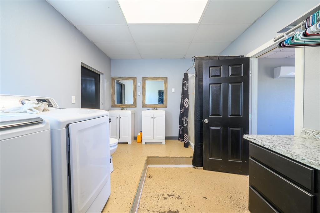 383 Soaring Eagle Trail Wichita Falls, TX 76310 - Photo 27 of 36 Laundry area featuring a paneled ceiling and separate washer and dryer
