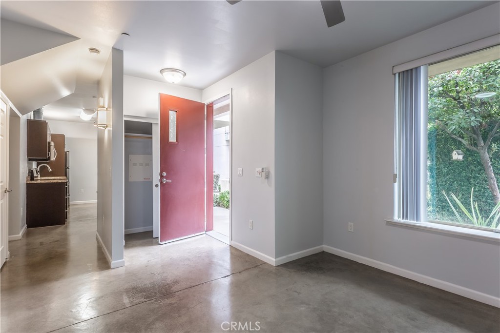 1759 Fulton Street Fresno, CA 93721 - Photo 17 of 24 a view of a hallway with a kitchen