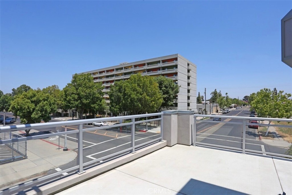 1759 Fulton Street Fresno, CA 93721 - Photo 18 of 24 a view of a roof deck with couches and sky view
