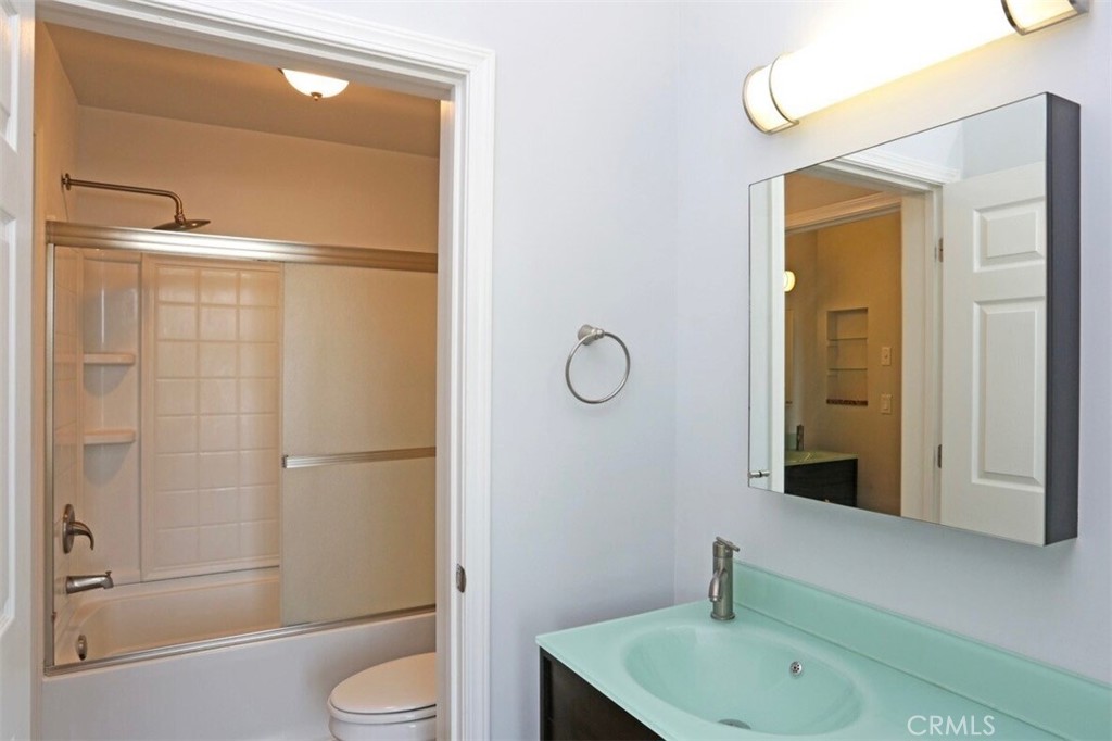 1759 Fulton Street Fresno, CA 93721 - Photo 23 of 24 a bathroom with a sink a toilet and shower
