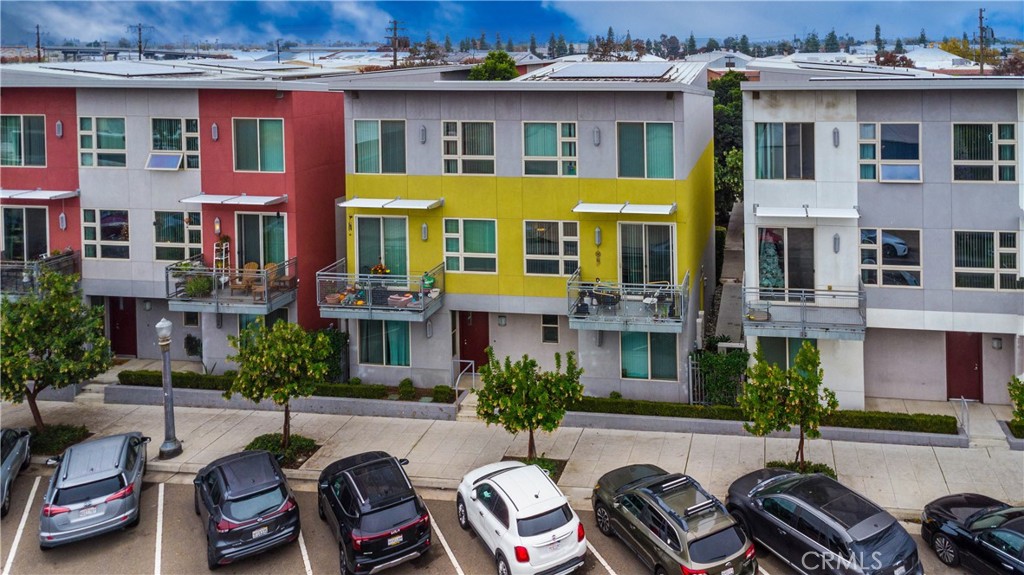 1759 Fulton Street Fresno, CA 93721 - Photo 3 of 24 a front view of a residential apartment building with a yard