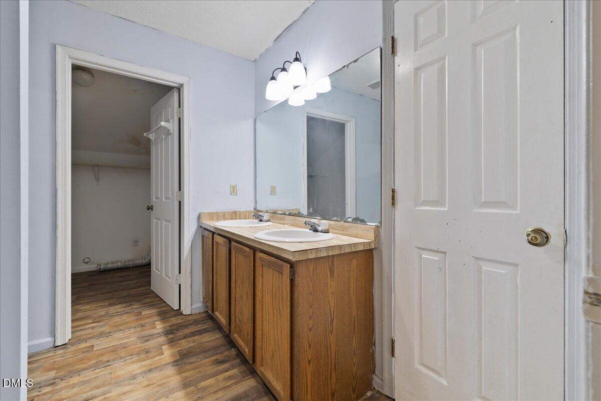 4409 Lake Ridge Drive Raleigh, NC 27604 - Photo 21 of 31 a bathroom with a sink and a mirror