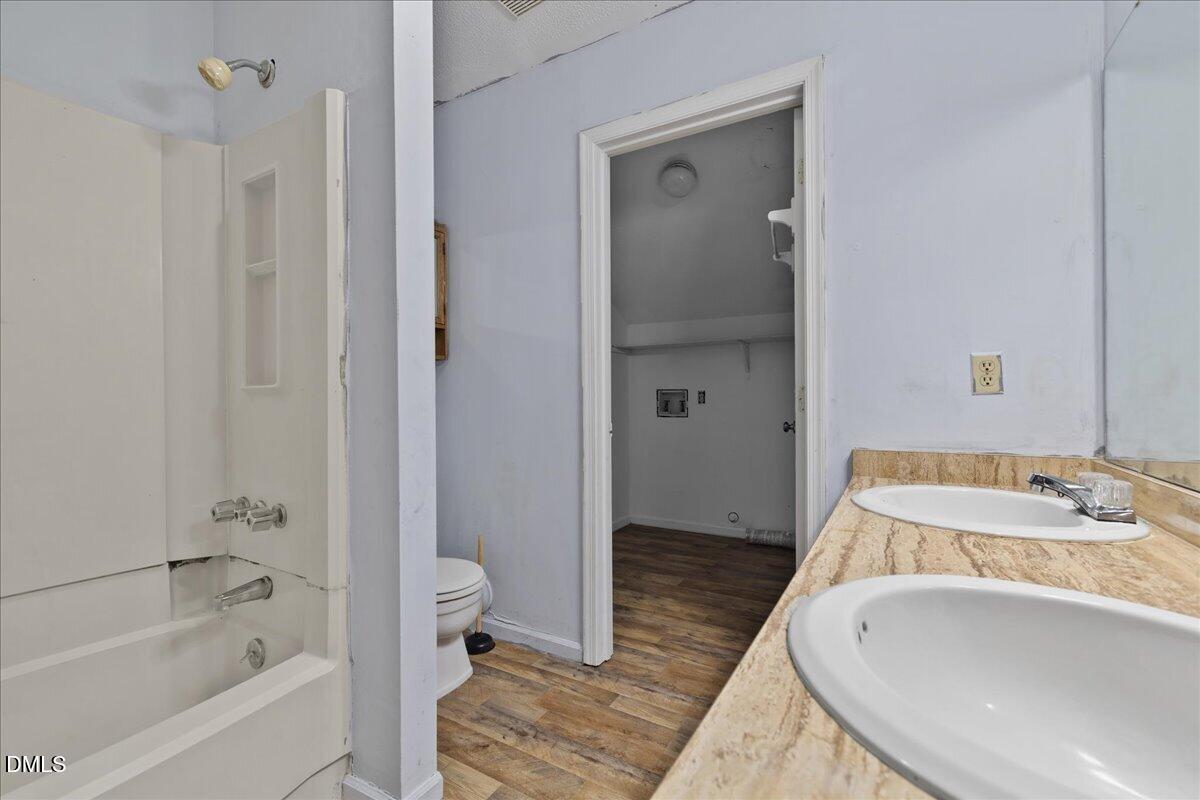 4409 Lake Ridge Drive Raleigh, NC 27604 - Photo 22 of 31 a bathroom with a tub and shower