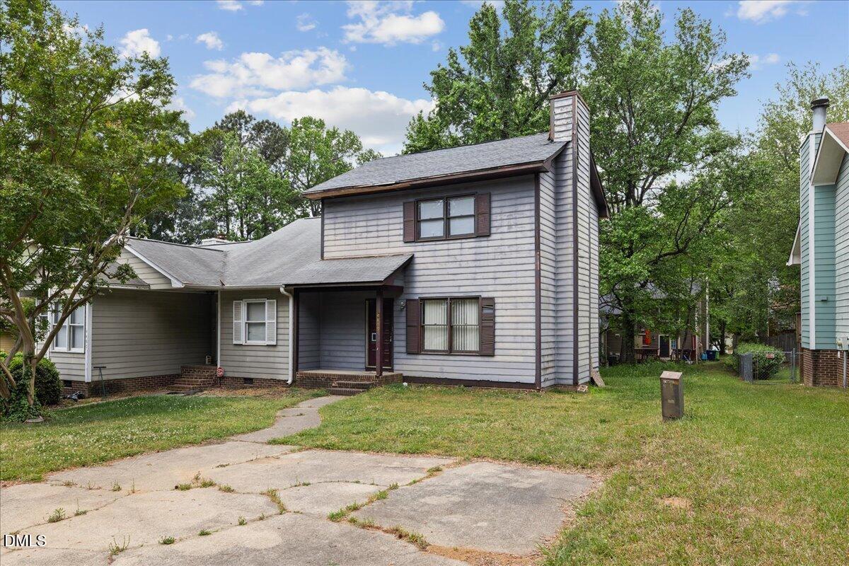 4409 Lake Ridge Drive Raleigh, NC 27604 - Photo 3 of 31 a front view of a house with a garden