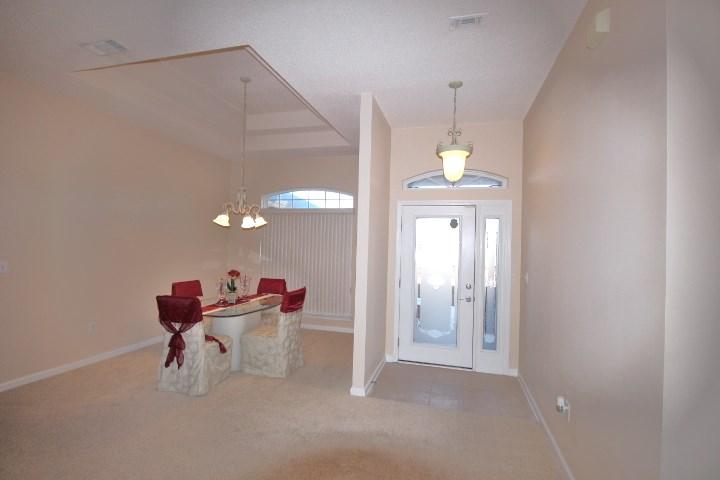 702 Riva Ridge Drive Crestview, FL 32539 - Photo 3 of 20 a dining room with furniture and wooden floor