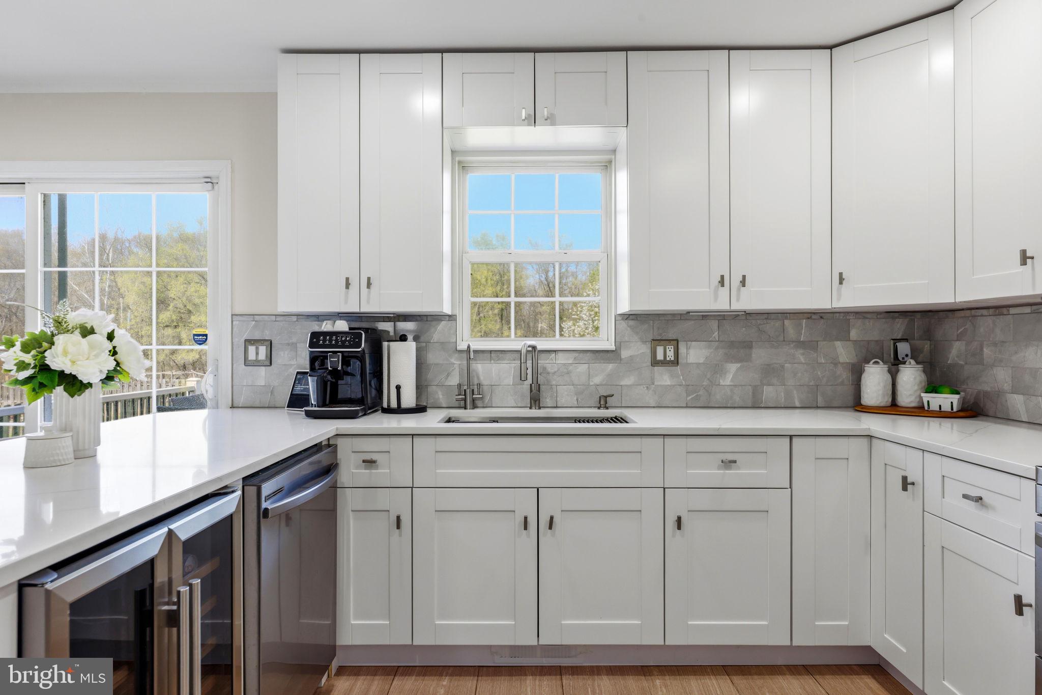 1439 Goodwood Avenue Baltimore, MD 21221 - Photo 18 of 49 a kitchen with white cabinets and sink