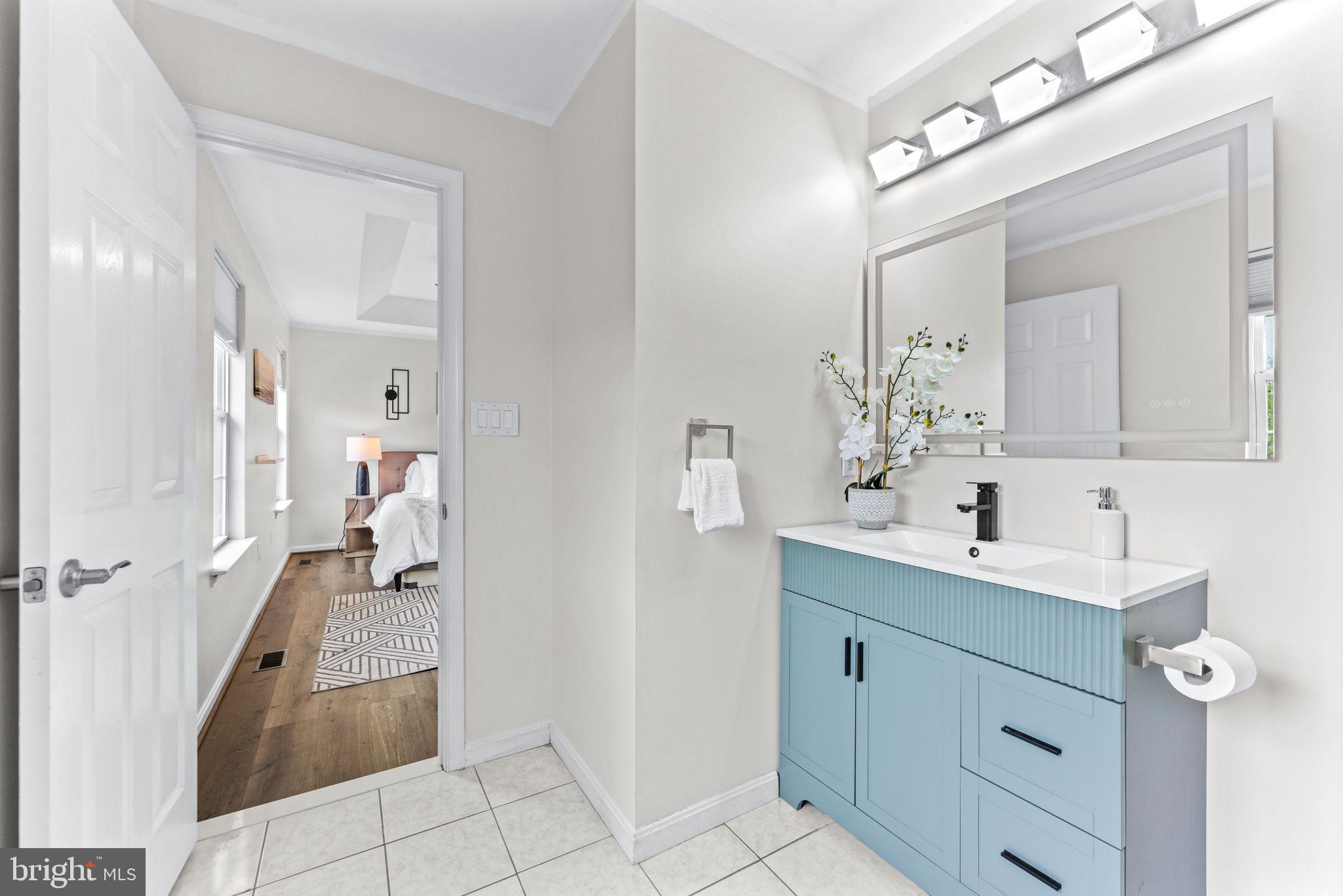 1439 Goodwood Avenue Baltimore, MD 21221 - Photo 29 of 49 a bathroom with a sink a toilet and mirror