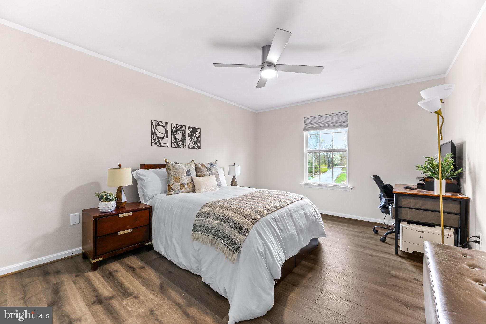 1439 Goodwood Avenue Baltimore, MD 21221 - Photo 30 of 49 a bed room with a bed and a chair