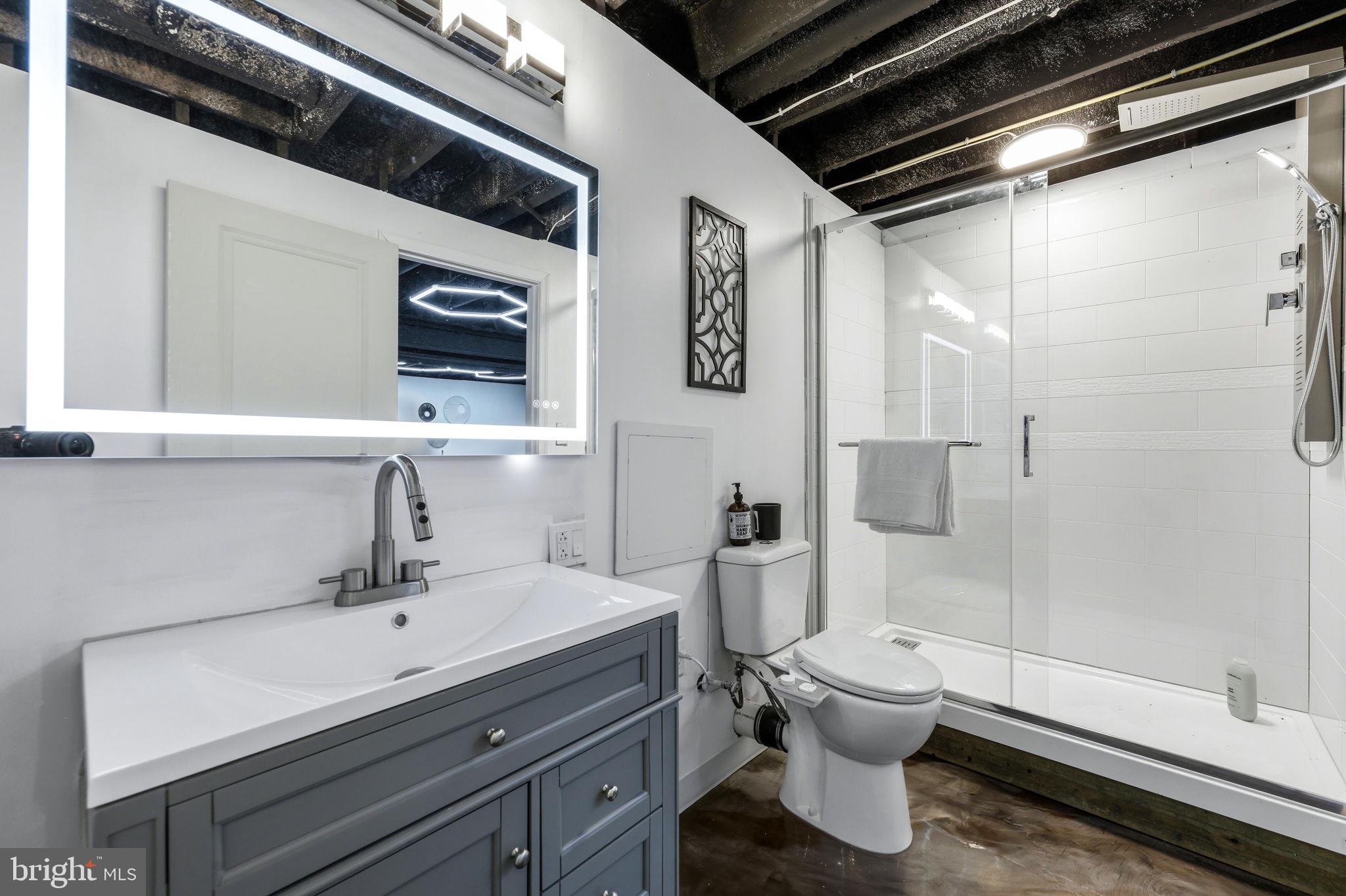 1439 Goodwood Avenue Baltimore, MD 21221 - Photo 40 of 49 a bathroom with a sink a toilet and shower