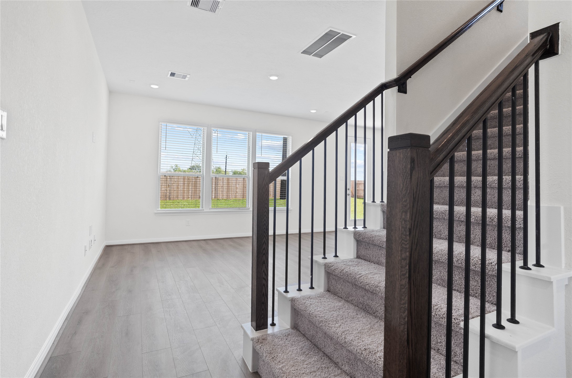 6403 Canby Court Rosharon, TX 77583 - Photo 4 of 23 Step into your new home at 22862 Magnolia Haven and be greeted by Warm Grey Layton Lake vinyl plank flooring, a stunning front door with decorative stippolyte glass, and fresh, bright paint—all coming together to create a warm and welcoming entryway.