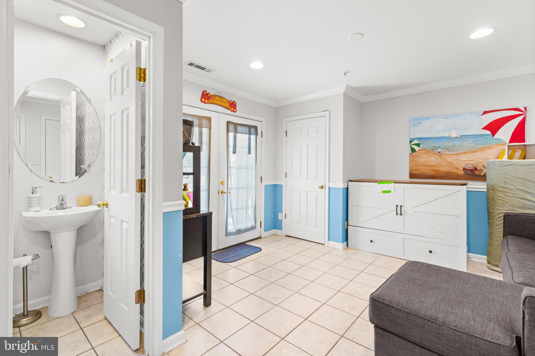 617 Salt Spray Road, Unit B Ocean City, MD 21842 - Photo 31 of 72 a bedroom with a bed and a sink