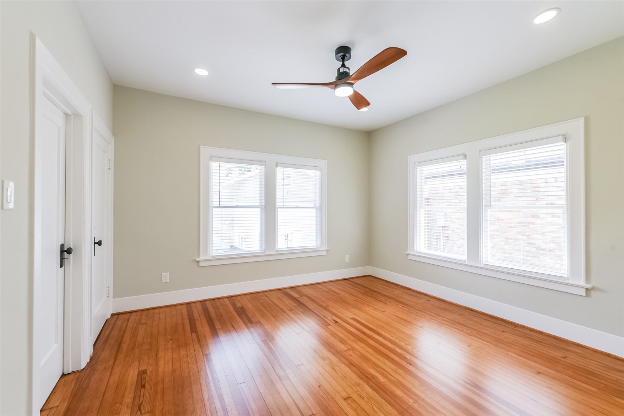 931 Teetshorn Street Houston, TX 77009 - Photo 19 of 25 wooden floor in an empty room with a window