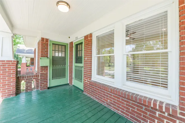 a view of a bedroom with windows
