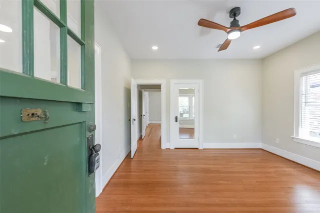 a view of room with window and wooden floor
