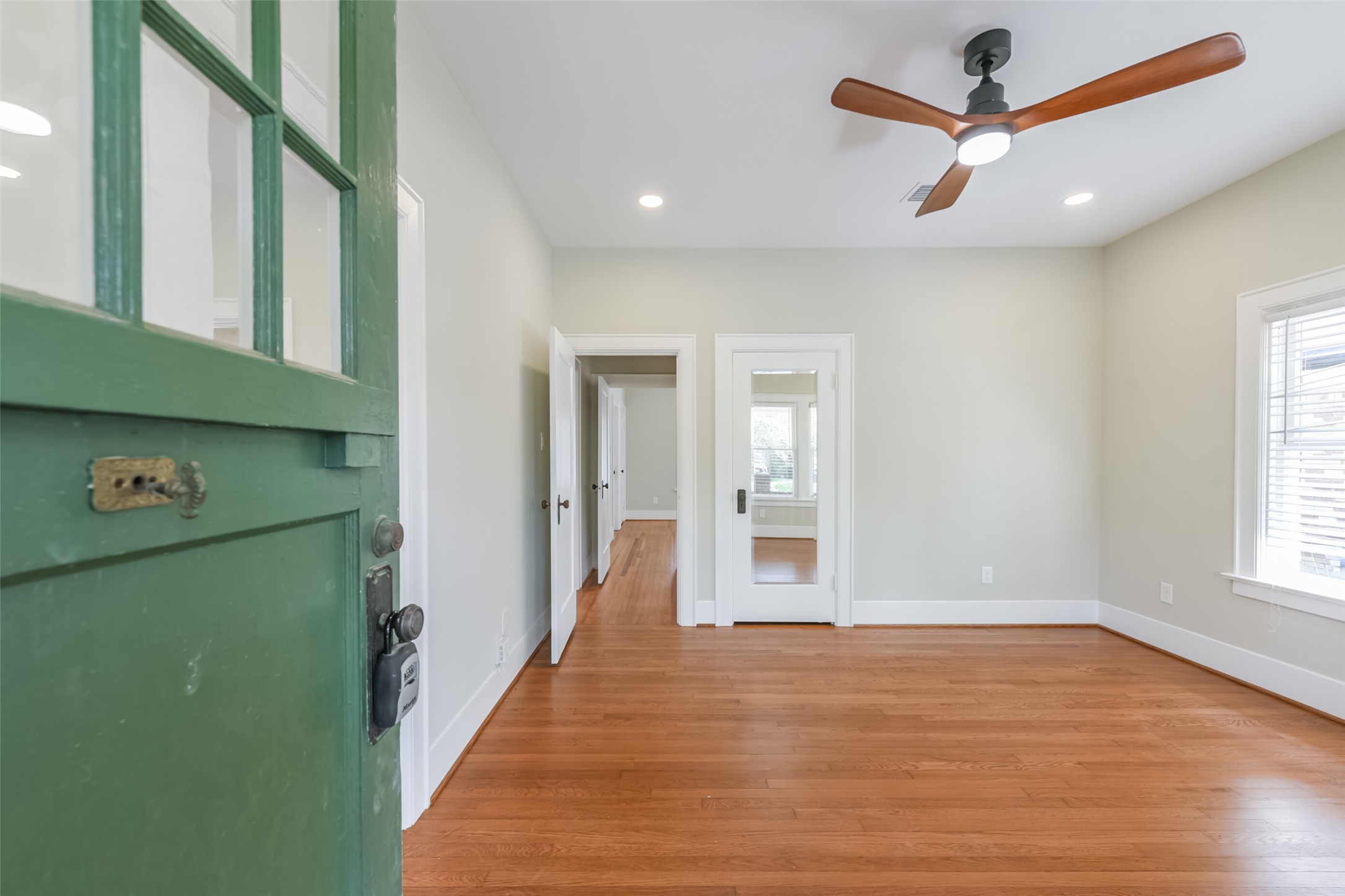 931 Teetshorn Street Houston, TX 77009 - Photo 5 of 25 a view of room with window and wooden floor