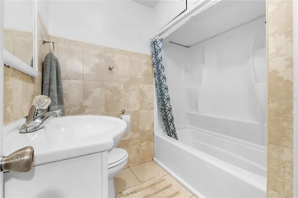 a bathroom with a sink a toilet and a bathtub