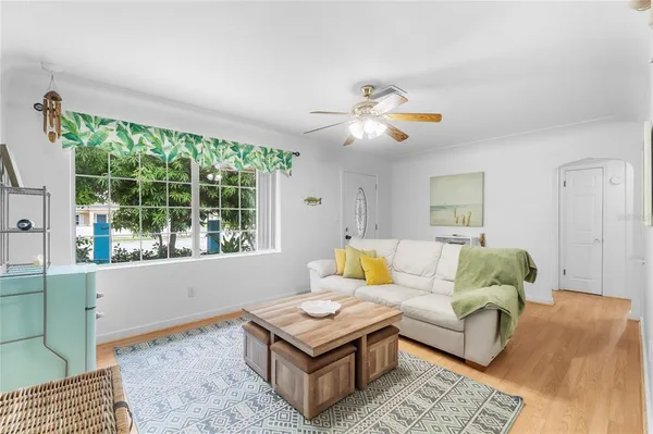 a living room with furniture and a large window