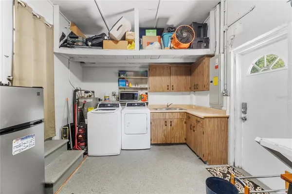 a kitchen with stainless steel appliances granite countertop a stove and a sink
