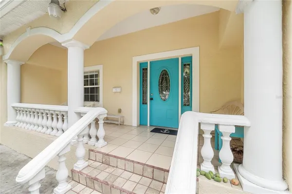 a view of an entryway with wooden floor